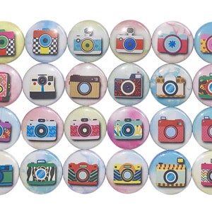 May include: A set of 24 colorful round buttons featuring vintage camera designs. Each button has a different camera design with various colors and patterns. The buttons are perfect for adding a touch of whimsy to crafts, clothing, or bags.