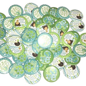 May include: A collection of green and blue round buttons with various eco-friendly messages, such as "Save the Earth", "Plant Some Hope", and "Be the Change".