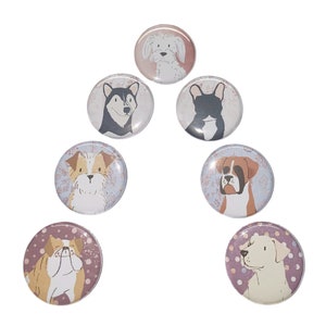 May include: Set of seven round, colorful buttons featuring different dog breeds. Each button has a white background with a floral pattern and a cartoon image of a dog. The dogs include a French Bulldog, a Boxer, a Husky, a Labrador Retriever, a Bulldog, a Jack Russell Terrier, and a Yorkshire Terrier.