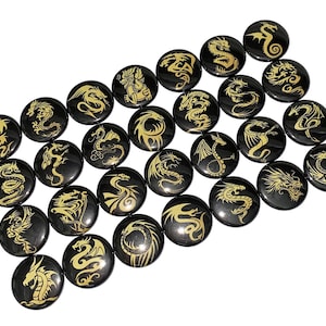 May include: A collection of 25 black round buttons with gold dragon designs.