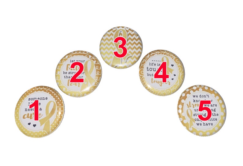 May include: Five gold and white round buttons with a gold ribbon and inspirational text. The buttons are numbered 1 through 5.