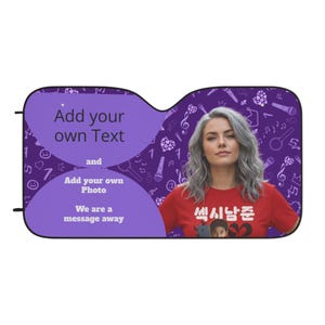 May include: Purple car sunshade with a woman's photo and text. The sunshade has a purple background with musical notes and microphones. Text on the sunshade says "Add your own Text" and "Add your own Photo".
