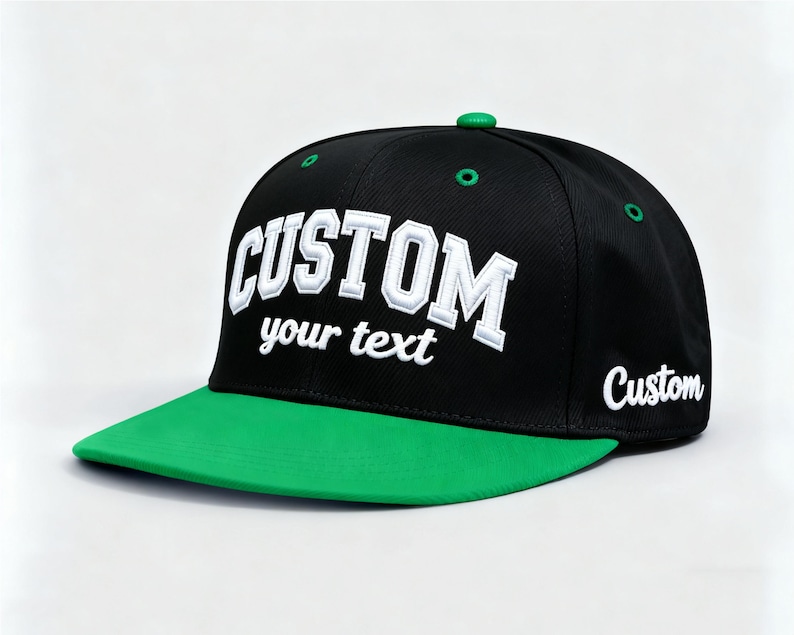 May include: Black and green custom baseball cap. The cap features the word "CUSTOM" in white, with "your text" below it. The brim is green, and the word "Custom" is on the side.