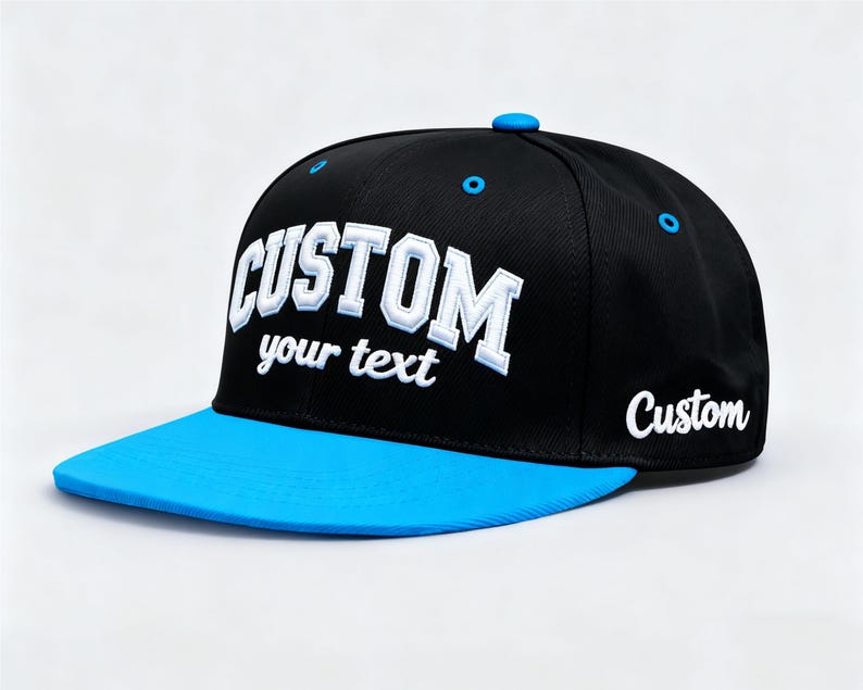 May include: Black and blue custom baseball cap with the word "CUSTOM" in white, bold, 3D lettering. The text "your text" is below the word "CUSTOM". The brim is bright blue, and the cap has a blue button on top.
