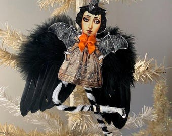 Halloween WITCH girl  ornament*She is ready to put a scare in the air at your house*Black feather wings*Bump chenille legs*German glitter