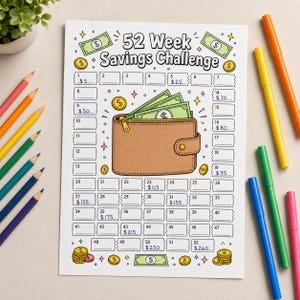 May include: A 52 Week Savings Challenge paper tracker featuring a central illustration of a brown wallet filled with green paper money. The page includes fifty-two numbered rectangular boxes for tracking progress, decorated with gold coins and dollar bills.