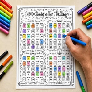 May include: A white paper sheet titled $500 Savings Jar Challenge featuring four decorative frames filled with small jar illustrations labelled $5. Some jars are coloured in pink, purple, yellow, blue, orange, and green, while others remain blank.