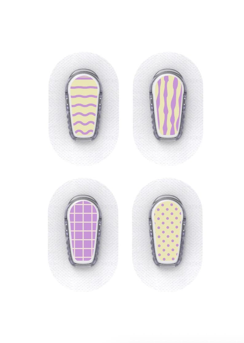 May include: Four medical device patches with decorative designs. Each patch has a different pattern: wavy lines, vertical stripes, a grid, and polka dots. The designs are in yellow and purple, set against a white background.