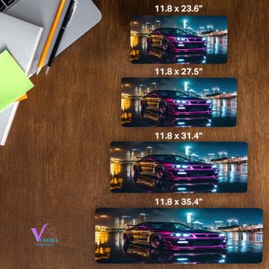 May include: Four rectangular desk mats with a purple sports car design. The mats are labeled with dimensions: 11.8 x 23.6 inches, 11.8 x 27.5 inches, 11.8 x 31.4 inches, and 11.8 x 35.4 inches. The car is set against a city skyline.