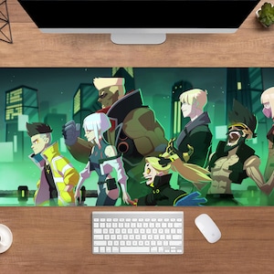 May include: A large rectangular mousepad featuring a group of stylized characters in a futuristic cityscape. The characters are diverse, with varying skin tones, hair colors, and outfits. The background is a dark green with illuminated buildings.