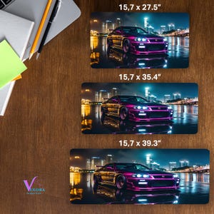 May include: Three rectangular mouse pads with a purple sports car design. The pads measure 15.7 x 27.5 inches, 15.7 x 35.4 inches, and 15.7 x 39.3 inches. The car is set against a cityscape at night.