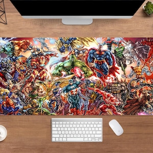 May include: A rectangular desk mat featuring a vibrant collage of comic book superheroes. The design includes characters like Superman, Batman, and the Hulk, in a colorful, action-packed composition. The mat is placed on a wooden desk, with a keyboard and mouse visible.