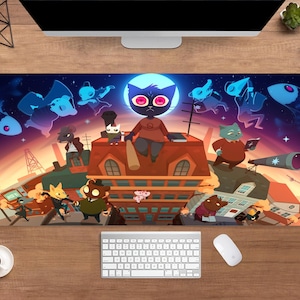 May include: A rectangular desk mat with a vibrant cartoon illustration. The design depicts animal characters on rooftops under a starry night sky. A keyboard and mouse are visible below the mat.
