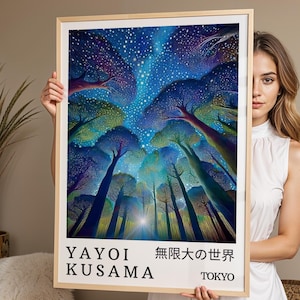 May include: A framed rectangular art print featuring a vibrant, colorful forest scene under a starry night sky. The text at the bottom reads YAYOI KUSAMA, the Japanese characters for infinite world, and TOKYO. The frame is a light-colored wood.