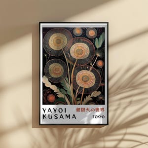 May include: A framed art print featuring a floral design with a black background. The artwork showcases stylized flowers in shades of yellow, orange, and green, with intricate details. The print includes the text "YAYOI KUSAMA" and Japanese characters.