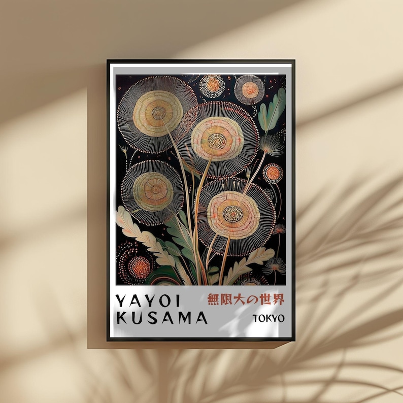 May include: A framed art print featuring a floral design with a black background. The artwork showcases stylized flowers in shades of yellow, orange, and green, with intricate details. The print includes the text "YAYOI KUSAMA" and Japanese characters.