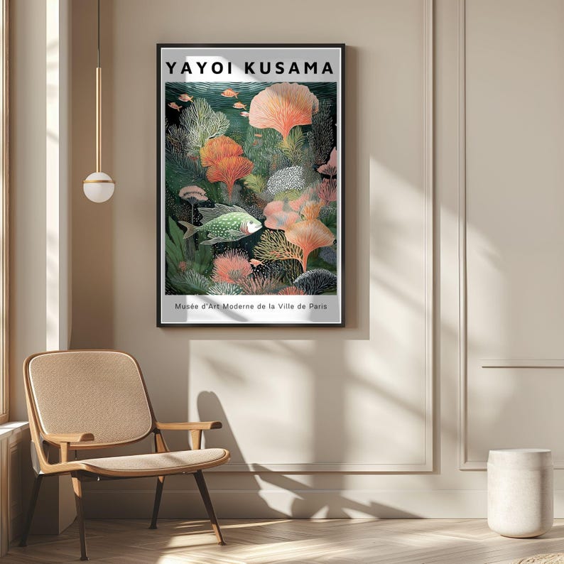 May include: A framed art print featuring a vibrant underwater scene with coral, fish, and the text "YAYOI KUSAMA." The artwork showcases a palette of greens, oranges, and blues, with the text "Mus&eacute;e d'Art Moderne de la Ville de Paris" at the bottom.