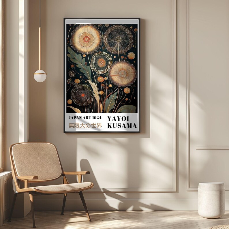 May include: A framed art print featuring a dark background with stylized, golden-yellow floral designs. The print includes text that reads "JAPAN ART 1924 YAYOI KUSAMA" and Japanese characters. The artwork is displayed on a beige wall.