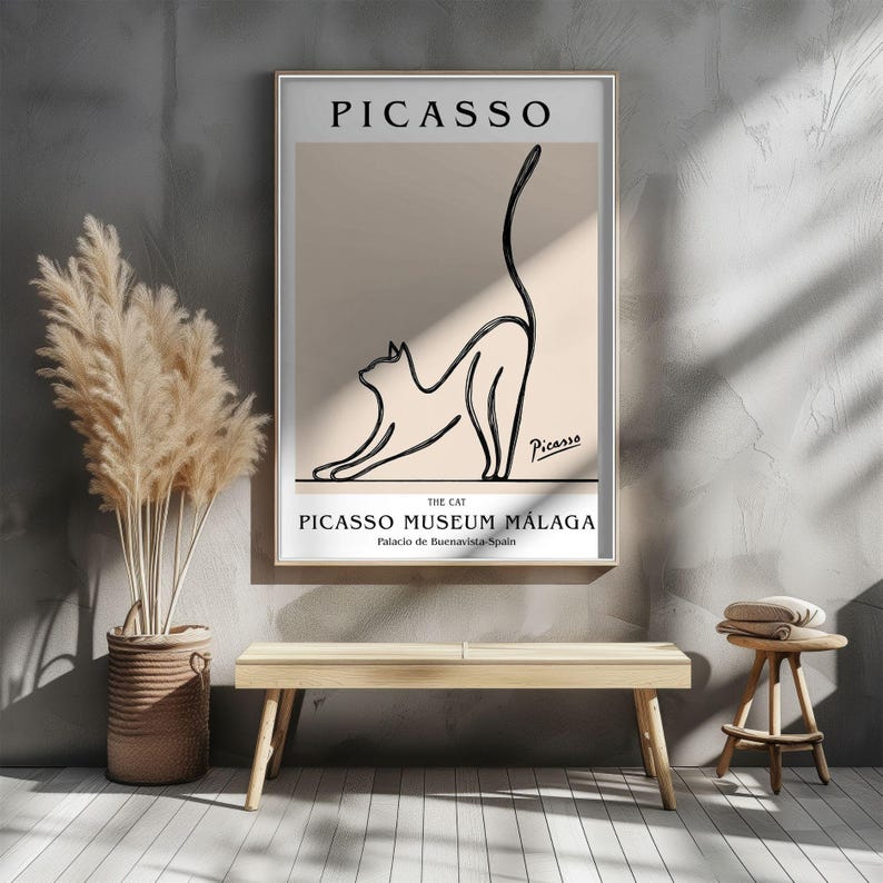Puede incluir: Una impresi&oacute;n art&iacute;stica enmarcada con un dibujo lineal minimalista de un gato estir&aacute;ndose. La impresi&oacute;n incluye el texto "PICASSO" en la parte superior y "PICASSO MUSEUM M&Aacute;LAGA" en la parte inferior, con la firma del artista.