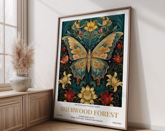 May include: Framed art print featuring a detailed butterfly design with teal, gold, and orange hues. The artwork is set against a dark background with floral accents. Text at the bottom reads "SHERWOOD FOREST" and "ENGLAND".