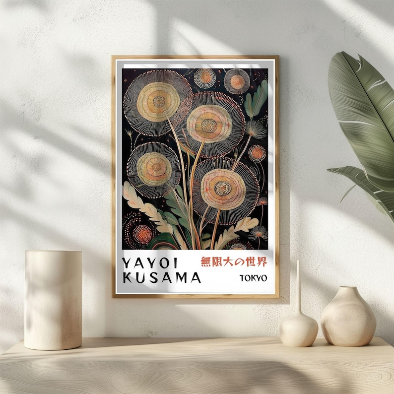May include: Framed art print featuring a stylized floral design with circular shapes in shades of yellow, orange, and green against a black background. The print includes the text "YAYOI KUSAMA" and Japanese characters, with "TOKYO" below.
