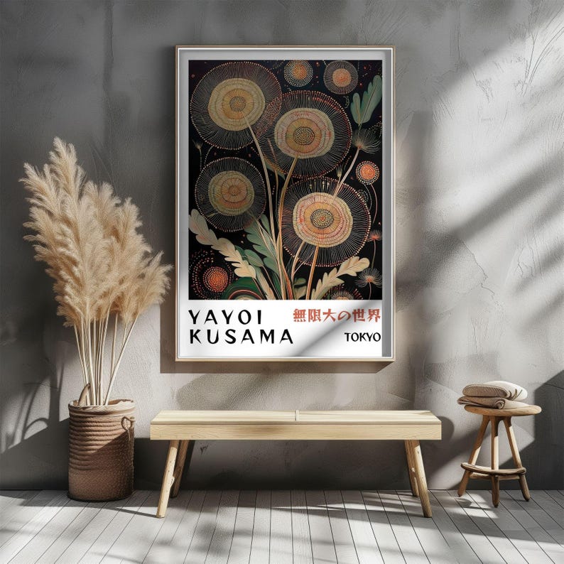 May include: A framed art print featuring a floral design with circular shapes in shades of yellow, orange, and green against a black background. The print includes text that reads "YAYOI KUSAMA" and Japanese characters, with "TOKYO" below.