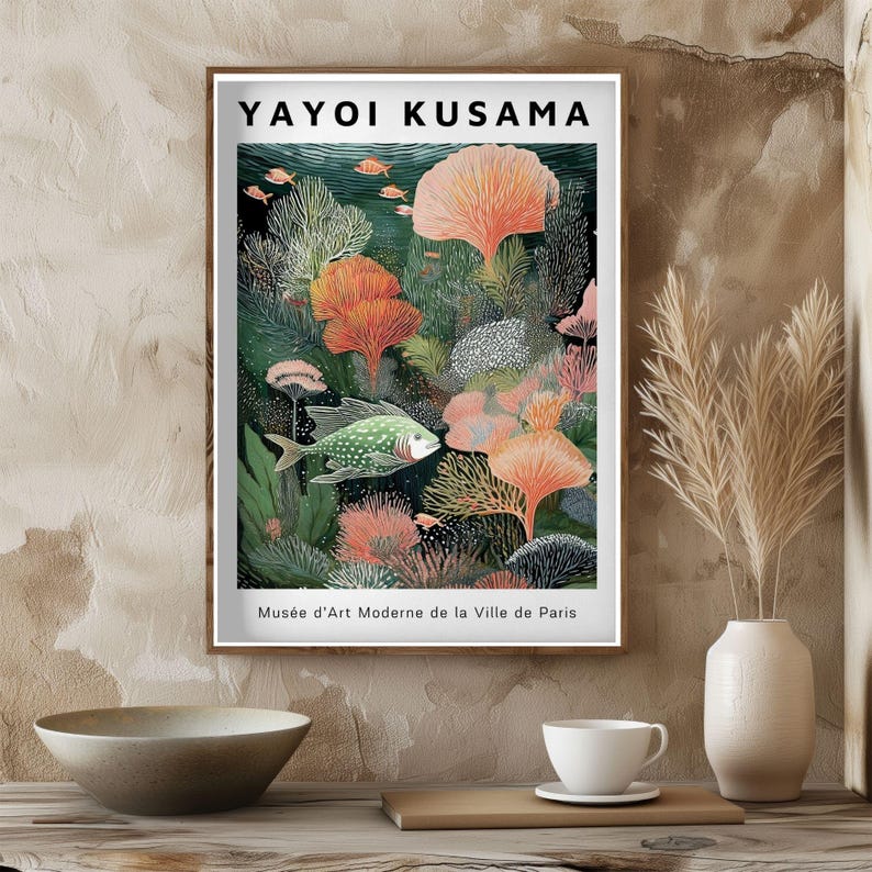 May include: A framed art print featuring a vibrant underwater scene with coral and fish. The artwork, by Yayoi Kusama, includes the text "Mus&eacute;e d'Art Moderne de la Ville de Paris". The color palette includes shades of green, orange, and blue.