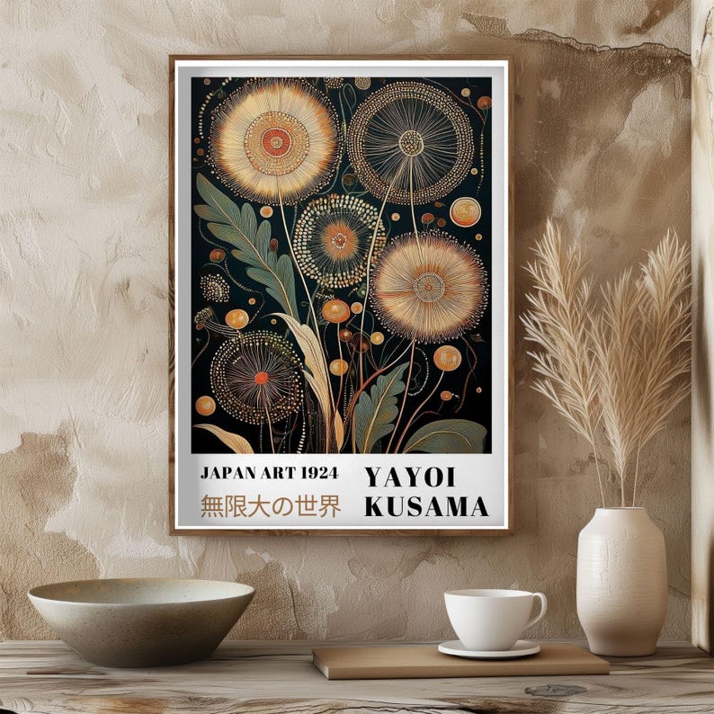 May include: A framed art print featuring a stylized floral design in shades of gold, orange, and green against a dark background. The print includes text that reads "JAPAN ART 1924 YAYOI KUSAMA" and Japanese characters.