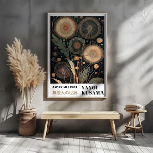 May include: A framed art print featuring a floral design in shades of gold, orange, and green against a dark background. The print includes text that reads "JAPAN ART 1924 YAYOI KUSAMA" in English and Japanese.