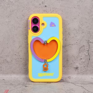 May include: A yellow and blue phone case with a heart-shaped design. The case has a yellow border, a light blue center, and a large heart with purple, orange, and yellow accents. The text "ggshare" is at the bottom.