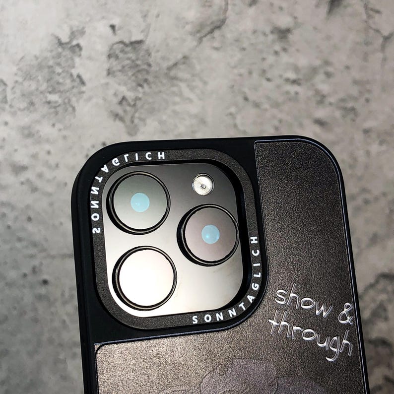 This artistic Show & Through Silk Texture Acrylic iPhone Case has a beautifully designed silk-textured backplate, offering a mirror-like glossy finish and a unique, semi-transparent look. The full silicone bumper around the edges provides added protection, absorbing shocks and preventing sweat accumulation. The case fits multiple iPhone models, including iPhone 13, 14, and 15 series. With its drop-resistant and scratch-resistant features