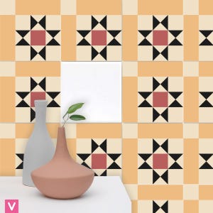 May include: A set of decorative ceramic tiles with a geometric pattern. The tiles are a light orange color with black and red accents. The pattern features a star shape with a square in the center.