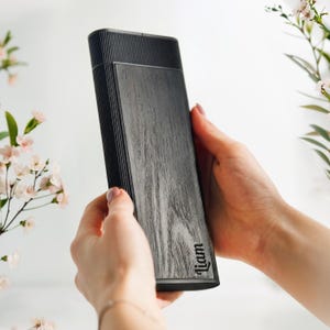 May include: A set of three ceramic mugs with a speckled, matte finish. The mugs are in shades of cream, light gray, and dark gray. Each mug has a simple, minimalist design, perfect for coffee or tea.