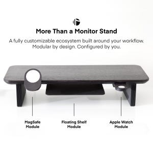 May include: A dark wood monitor stand with a floating shelf and modules for MagSafe and Apple Watch. The stand has the text "More Than a Monitor Stand" and "A fully customizable ecosystem built around your workflow. Modular by design. Configured by you."