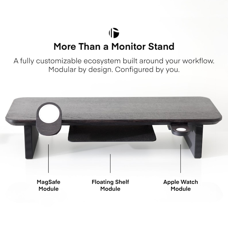 May include: A dark wood monitor stand with a floating shelf and modules for MagSafe and Apple Watch. The stand has the text "More Than a Monitor Stand" and "A fully customizable ecosystem built around your workflow. Modular by design. Configured by you."