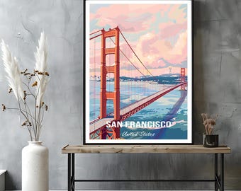 May include: A framed art print featuring the Golden Gate Bridge in San Francisco. The artwork depicts the bridge in shades of orange and red, with a blue bay and a pink and blue sky. The text "SAN FRANCISCO United States" is at the bottom.