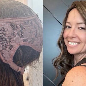 May include: A brown wig with a lace front and a pink lace trim. The wig is styled with long, wavy layers. A woman with brown hair and highlights smiles at the camera, showcasing the wig's style.