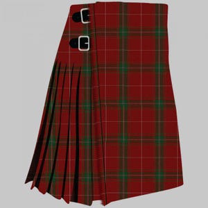 May include: A traditional kilt in a red and green tartan pattern. The kilt features pleats on the side and two black leather straps with silver buckles. The fabric has a woven texture.