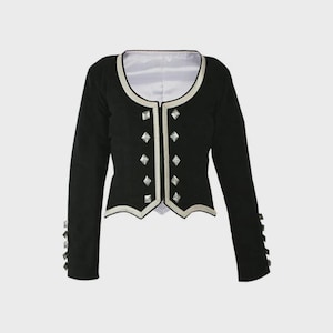 May include: Black jacket with long sleeves, featuring silver diamond-shaped accents down the front and on the cuffs. The jacket has a white lining and silver trim along the edges. A formal garment.