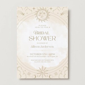 May include: A beige bridal shower invitation with gold celestial illustrations. The text reads "Please join us for a bridal shower in honor of Allison Anderson. October 5th | 12pm RH Rooftop Restaurant | New York, NY. RSVP before September 20th Allison: 555-555-0000"