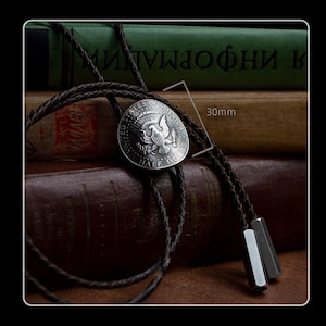 American coin bolo tie with brown leather and brushed silver tips – stylish men’s necklace for everyday wear, cowboy looks or vintage collectors.