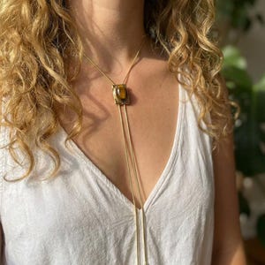 Elegant Y necklace featuring natural tiger eye pendant and fine adjustable gold chain designed for women’s western fashion.