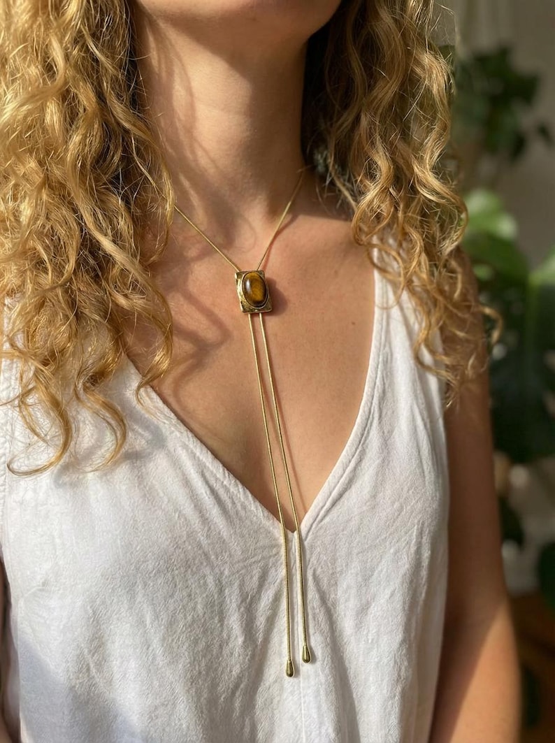 Elegant Y necklace featuring natural tiger eye pendant and fine adjustable gold chain designed for women’s western fashion.