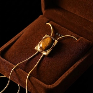Cowgirl inspired Y necklace styled with modern outfit showing elegant western fashion styling.