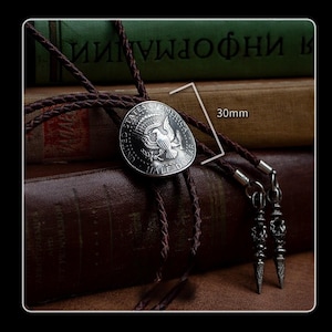 Vintage silver half dollar bolo tie shown with 30mm pendant and textured brown leather – western-inspired men’s fashion accessory or meaningful gift.