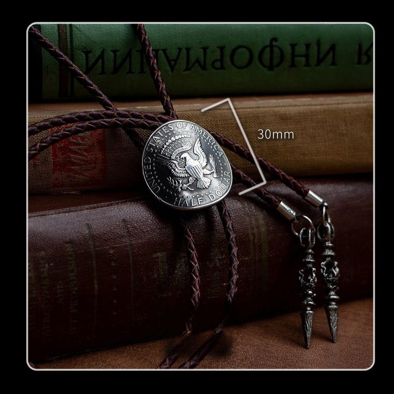 Vintage silver half dollar bolo tie shown with 30mm pendant and textured brown leather – western-inspired men’s fashion accessory or meaningful gift.