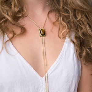 Vintage western style necklace with tiger eye stone centerpiece inspired by classic cowgirl bolo tie jewelry.