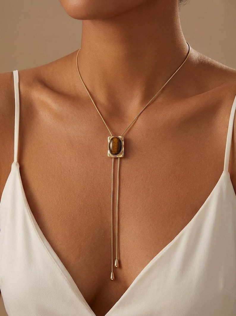 Western cowgirl bolo necklace worn with a dark dress shirt highlighting the refined old money aesthetic.