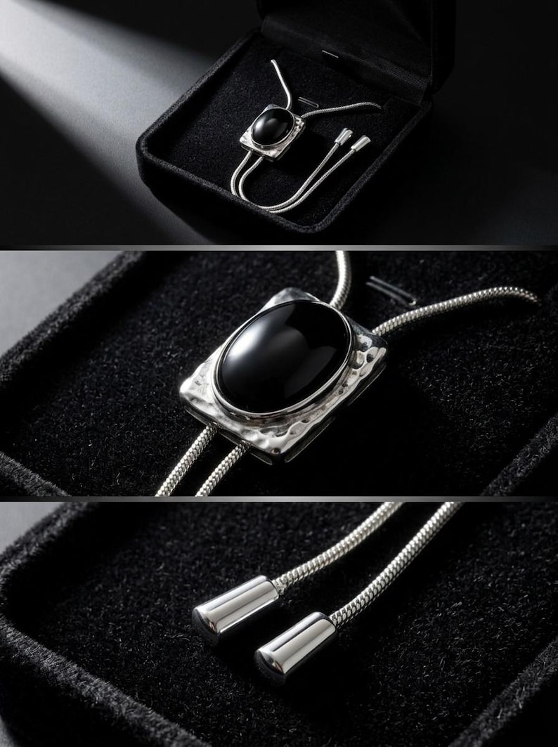 Close-up of black onyx pendant set in a silver-tone frame, showing smooth polished surface and reflective shine, paired with a delicate adjustable chain in a bolo tie Y necklace style for women.