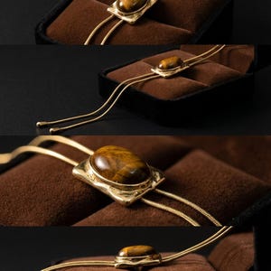 Minimalist women’s western jewelry with gold sliding chain and tiger eye pendant perfect for dresses and blouses.